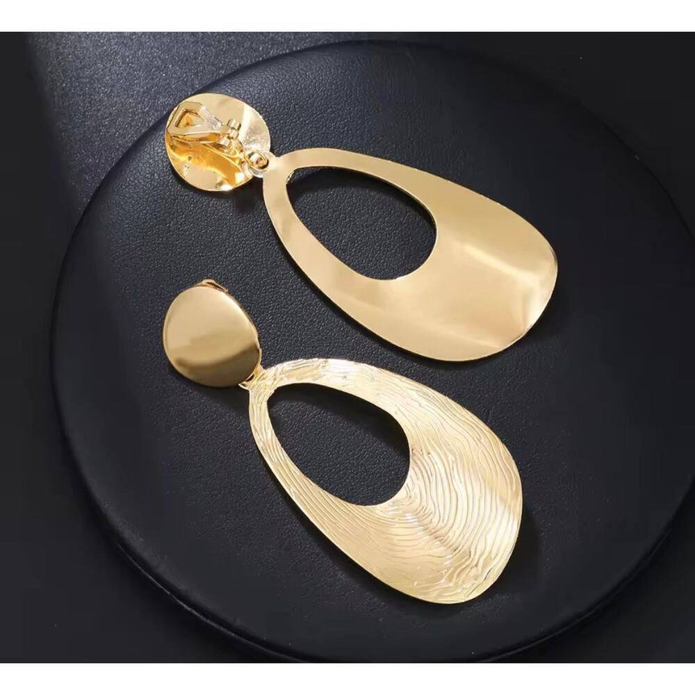 Copied - Clip on 2 3/4" lightweight shiny gold bent textured dangle earrings